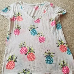 Neon colored pineapple print deep V tee.